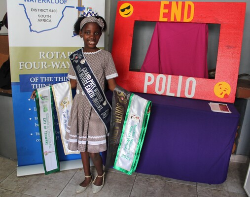 Keabetswe Temane displaying her competitive sashes at the 2022 awards.